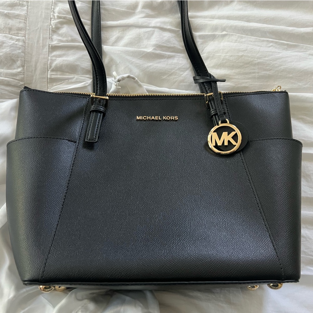 Michael Kors Black Leather Shoulder Bag with Elegant Gold Accent.